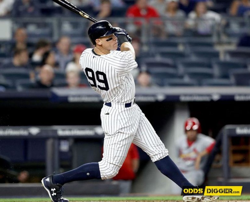 Baseball player sending the ball in the distance