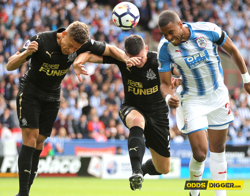 Ciaran Clark and Dwight Gayle battle with Mathias Zanka