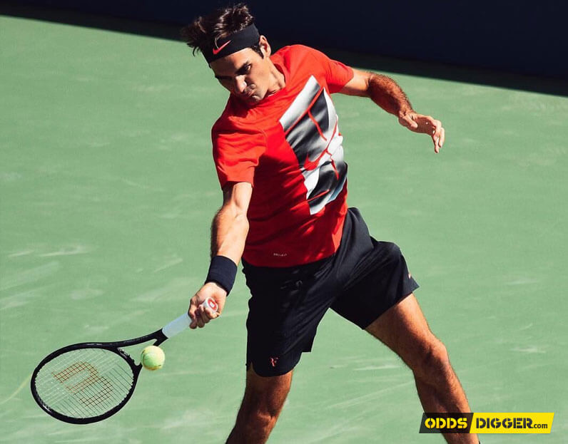 Roger Federer sending ball