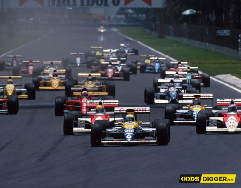 F1 racing cars pictured right after the start of a Grand Prix