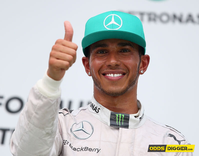 Lewis Hamilton smiling after winning a race
