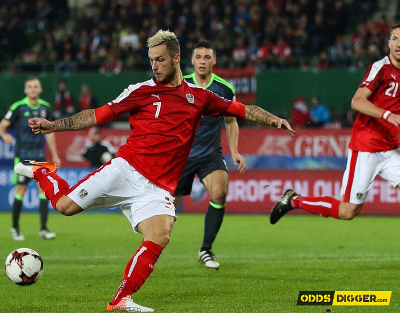 West Ham’s Marko Arnautovic gets a shot away against Wales.